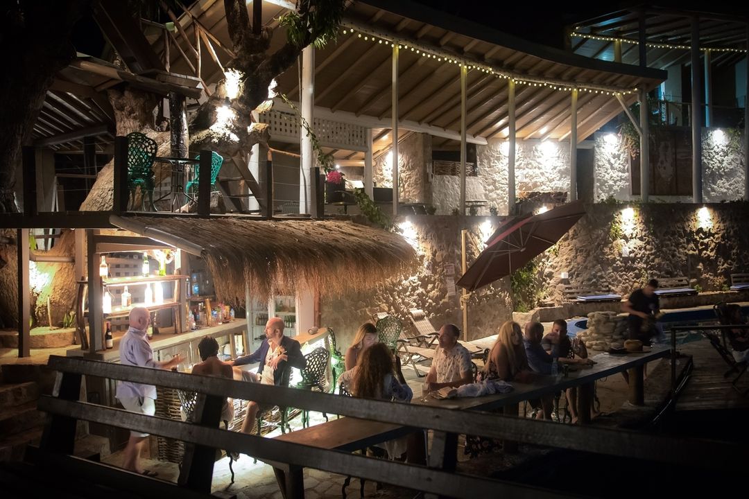 Guests at the Saltfish bar in the evening