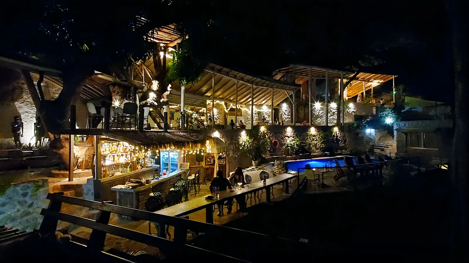 Saltfish Restaurant and Green Fig Resort lit up at night