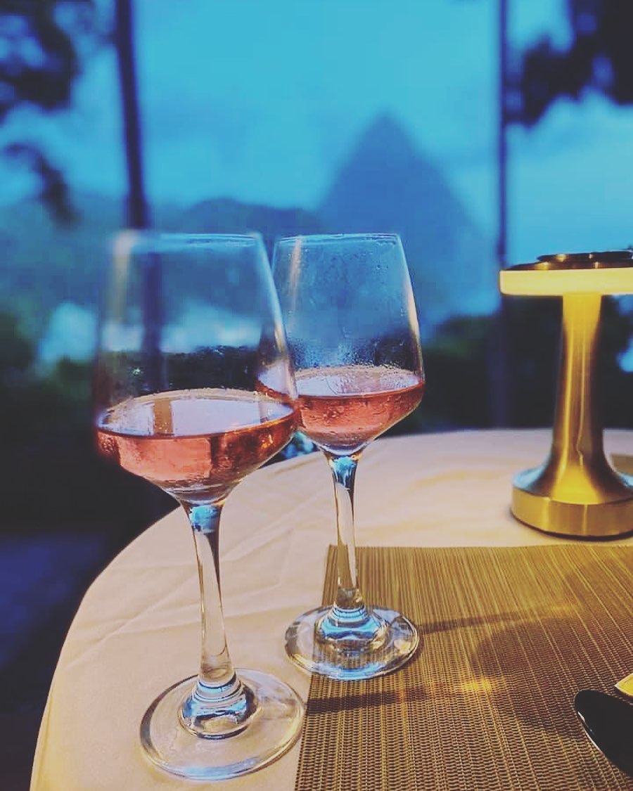 Two glasses of rosé on a table with a view